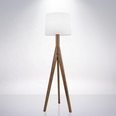 China Three Leg Modern Tripod Wooden Floor Standing Lamp With White Fabric Shade For Hotel Interior Decoration for sale