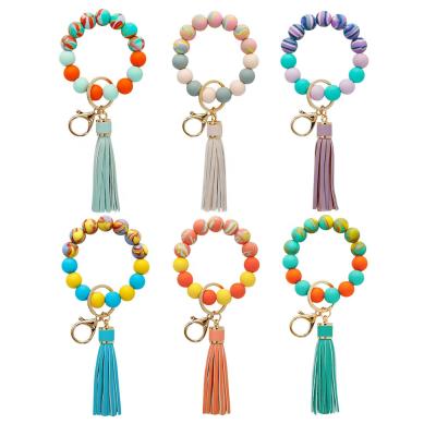 China Colorful Silicone Wristband Keychain Silicone Beaded Wristband Leather Tassel Gifts Festival Party For Fashion Home Creative Women Key Chain for sale