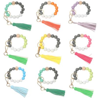 China New Wooden Beads Leather Colorful Bracelet Key Chain For Women Color Leather Wooden Bracelet Candy Tassel Bead Key Chain PU Tassel Key Chain for sale