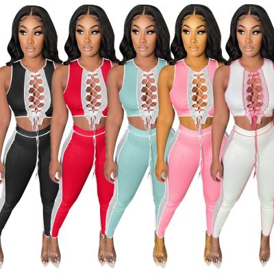 China Anti-Wrinkle Plus Size Women's 2 Piece Club Outfit Lace Up Bandage Crop Top Summer Pants Two Piece Sets For Women for sale