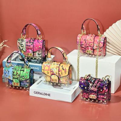 China Waterproof women's handbags and purses 2021 new graffiti chic ladies purse trend rivet purses for women for sale