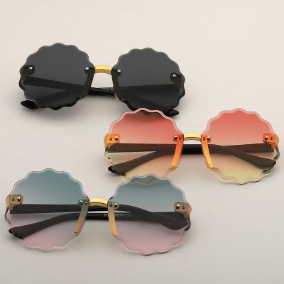 China Kids Rimless Sunglasses Fashion Design Good Quality Fashionable Sunglasses Baby Polarized Lil Girl Sunglasses Kid Round Flower Shape Kids Rimless Sunglass for sale