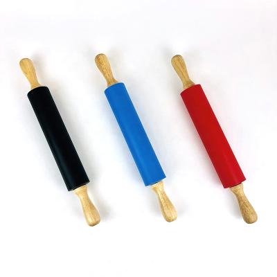 China Large Sustainable Dough Tools Non Stick Silicone Outdoor Wood Handle Noodle Dumpling Pin for sale