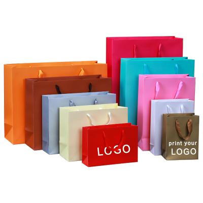 China Disposable Waterproof High Quality Colorful Washable Paper Gift Bag Clothing Package Paper Packing Bag for sale