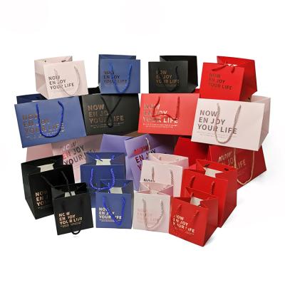 China OEM Handmade High Quality Multi Color Printed Luxury Paper Gift Bag With Rope for sale