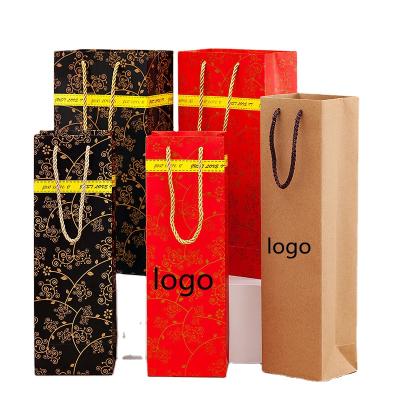 China 2021custom wine paper bag brown paper bags gift paper packaging disposable shopping clothes packing high quality packaging bag for sale