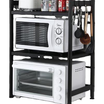 China Sustainable Telescopic Carbon Steel Kitchen Microwave Storage Racks Holding Microwave Oven Storage Racks for sale