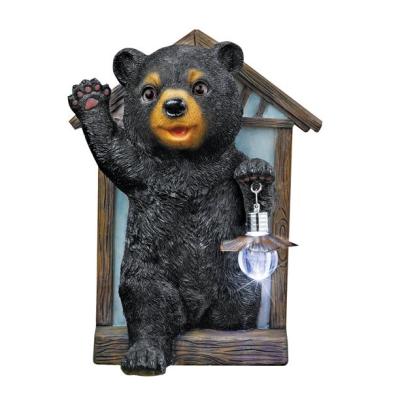 China Polyresin Minimalist Hand Painted Bear Sculpture with Lantern Lawn for sale