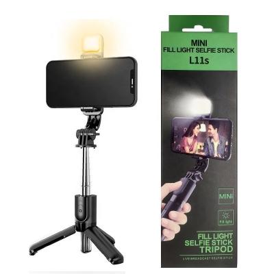 China Fold New Compact Size Radio Selfie Tripod Stick Up Tripod With Outdoor And LED Fill Light for sale