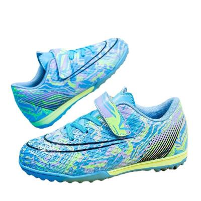 China Children's football boots spike rubber training sneakers safety protection and strapless tf unique teenagers wear resistance strapless training sneakers students for sale