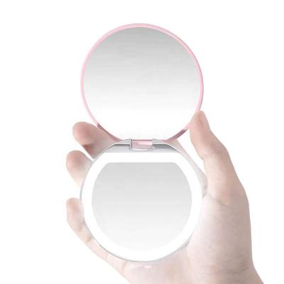 China Amazon Hotsale Customizable Portable Pocket Hand Lighted Vanity Mirror Magic Makeup Mirror With LED Light for sale