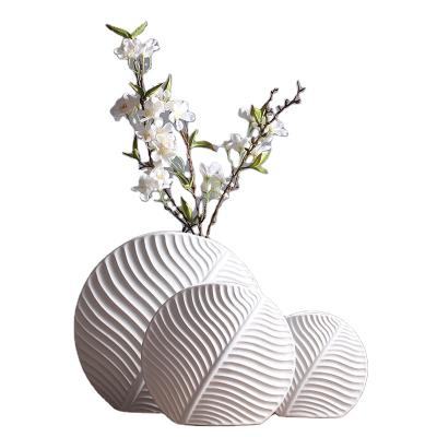 China Modern Nordic Creative Minimalist Style Nordic Ceramic Vase Eggshell White Flower Arrangement Open Decorative Ornaments Makers for sale