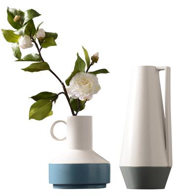 China Hot Sale Simple Luxury White Ceramic Vase Minimalist Modern Creative Decoration Home Decor And Light for sale