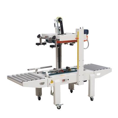 China Automatic Food High Performance Food Sealing Box Packing Machine With Bottom Conveyor for sale