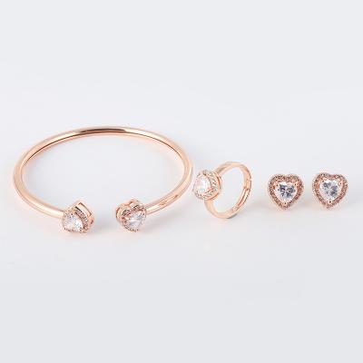 China FASHIONABLE design high quality luxury heart shaped zirconia charm brass bracelet set for women and men for sale