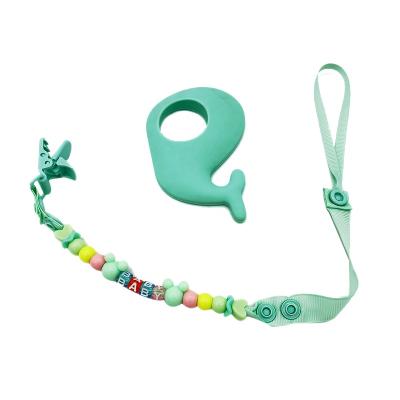 China Silicone Material Cute Exquisite Color Chained Dolphin Q Combination Craftsman Quality Baby Teether Teether for sale