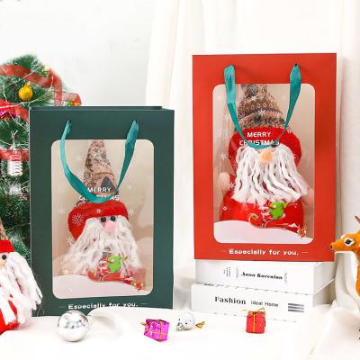 China Recycled Materials Paper Bag Christmas Eve Christmas Scarf Sack Gift Colored Paper Bag With Window for sale