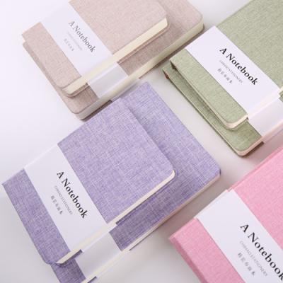 China Customized Easy Writing Canvas Notebook Eco-Friendly Solid Color Blank Fabric Eco-Friendly Hardcover Book With Belly Band for sale