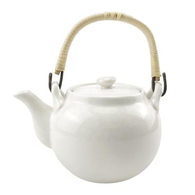 China Viable Chinese Traditional Japanese Style 21.4 Ounce Ceramic Teapot Kettle with Rattan Handle Stainless Steel Infuser for sale