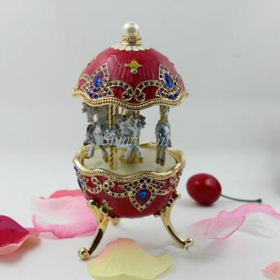 China Wedding Gifts Egg Shape Metal Materials Carousel Music Box For Wedding Gifts for sale