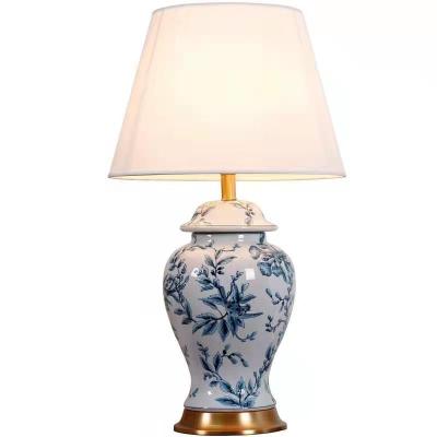 China Modern Chinese Classical Blue And White Ceramic Pot Body Fabric Table Lamp Led Beside Light With Copper Base for sale