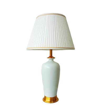 China Light luxury simple style fabric table lamp pure white ceramic desk bedroom reading LED bedside decorative lamp for sale