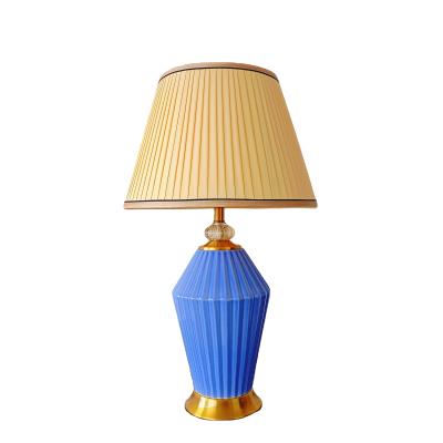 China Modern simple home decor luxury style fabric table lamp porcelain ceramic single living room bedroom led light for sale