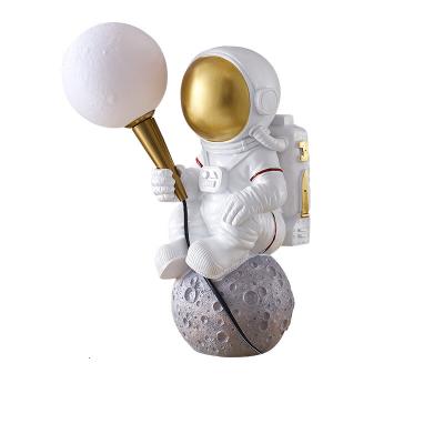 China Cartoon modern resin moon planet table lamp bedroom children's room bedside LED creative decorative table lamp for sale