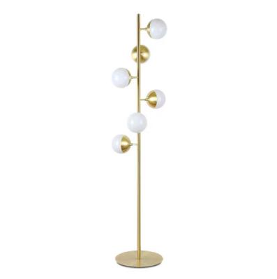 China Modern simple modern simple warm light hotel multi head metal gold lamp shade glass ball floor lamp vertical bedroom living room lamp for sale