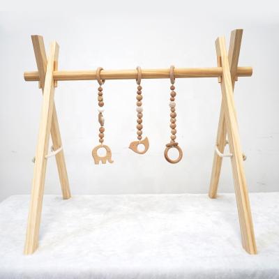 China Baby Soft Wooden Gym with Wooden Teething Animal Baby Toys Foldable Baby Play Gym Frame for sale