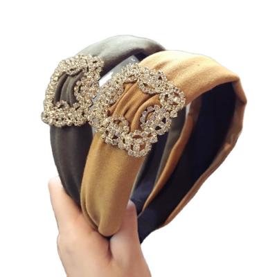 China Korean fashion exquisite shiny retro women's hair accessories fabric sells colorful wide cross crystal twisted hair band for sale