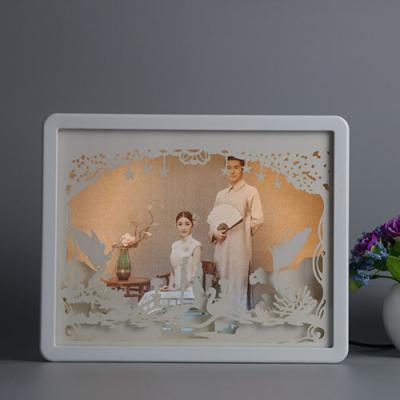 China High Quality Envrioment Friendly ABS Resin Carving Art Photo Frame With Paper Cut Out Lamp Photo Frame for sale