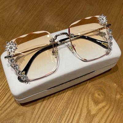 China Fashion Sunglasses Fashion New Fit Glasses Luxury Diamond For Women Shades Summer Rimless Sunglasses for sale