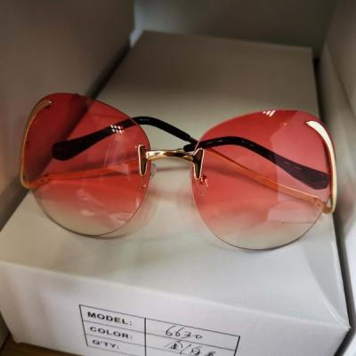 China Fashion Sunglasses 2022 Brand Designer Newest Fashion Rimless Bend Leg Glass Women Sun Glass Shades Trendy Colorful Oversized Sunglasses for sale