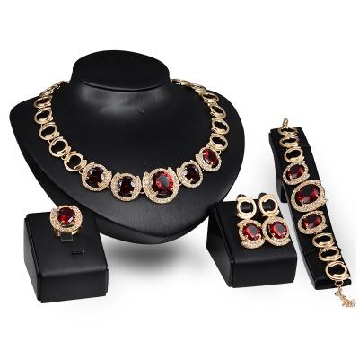 China Fashion Gold Trendy Jewelry Four Pieces Red Crystal Women's Banquet Jewelry Set For Wedding for sale