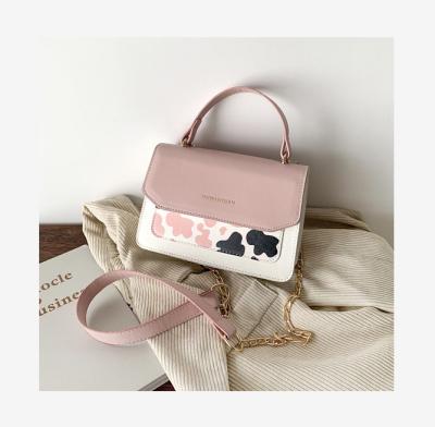 China Fashion cow pattern candy color stitching ladies bag 2022 new summer simple small shoulder bag handheld messenger bag for sale