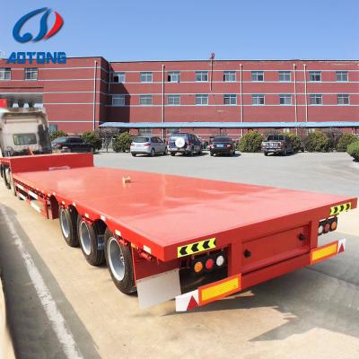 China Tri axle flatbed truck trailer 20ft 30 ton low bed semi trailer new or used 40ft 3 axle low bed semi flatbed trailer for sale