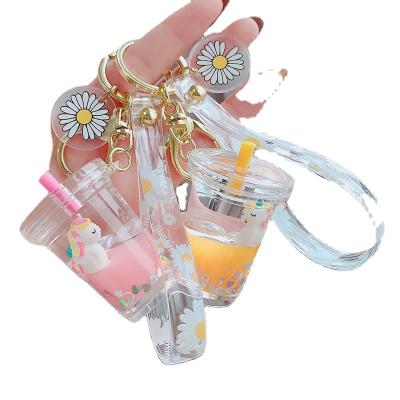 China Portable New 2021 Glitter Quicksand Key Chain Milk Liquid Floating Tea Cups Unicorn Keychain for sale