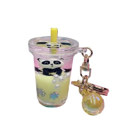 China 2021INS Fashion Girl in Panda Floating Quicksand Liquid Milk Teacup Key Chain Bag Key Chain Pendant for sale