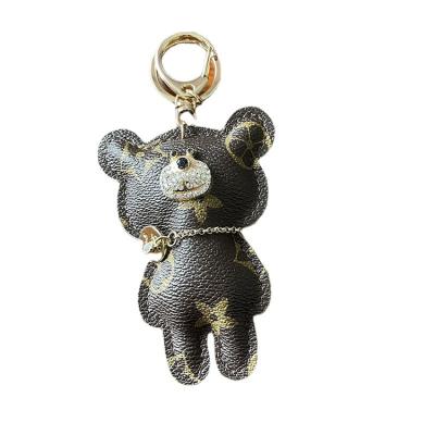 China Key Chains Women Teddy Bear Designer Car Keychain Wholesale Promotion Gift Ladies Plaid Luxury Pendant Cute Monogram Bag Charm for sale