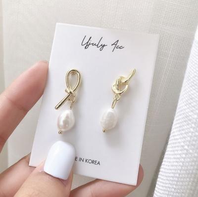 China Fashionable creative asymmetrical knot earrings female vintage pearl earrings S925 silver mail earrings for sale