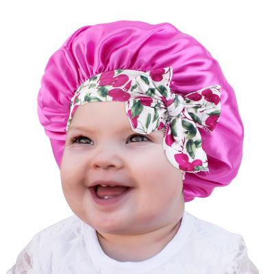 China Fashion Kids Satin Solid Color Sleep Hat Cute Bow Hair Care Hood Night Cap Hood Turban Elastic Headwear for sale