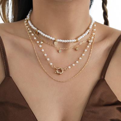 China Fashion Set Multi-Layer Cross Chain Women Rhinestone Pearl Sequins Tassel Necklace Mix And Match Ornaments Necklace for sale