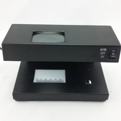 China To check bills by popular selling currency detector in 4 ways with UV, MG, WM and magnifying glass for sale