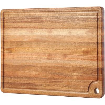 China Sustainable Large kitchen wooden cutting board with juice slots and handle holes acacia wood cutting board for sale