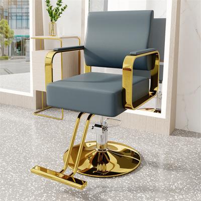 China Modern Xingyi Hairdressing Makeup Styling Equipment Barber Chair Men Gold Color Barber Chair Guangdong Factory Outlet salon chair for sale