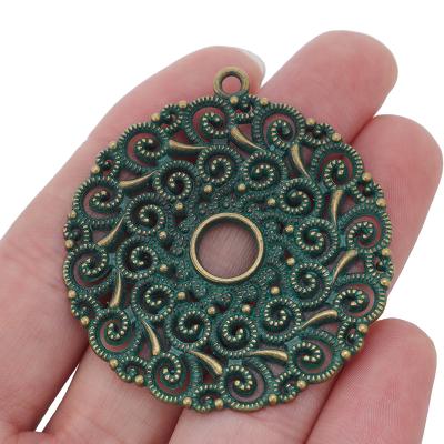 China FASHIONABLE Green Patina Metal Verdigris Cavity Flower Spiral Large Round Swirl Charms Pendants For Necklace Jewelry 53x48mm for sale