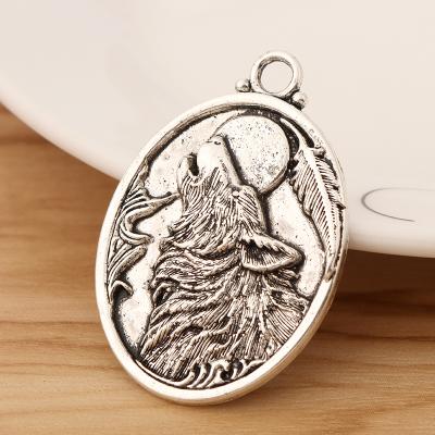 China TRENDY Animal Necklace Jewelry Making Findings 46x32mm Wolf Head Oval Charms Pendants Tibetan Silver for sale