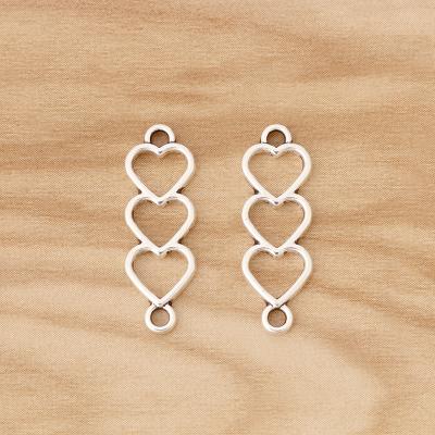 China Popular Tibetan Silver Hollow Hearts Connector Charm For Bracelet Necklace Jewelry Making Accessories for sale