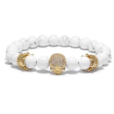 China FASHIONABLE handmade high quality white stone howlite beads skull bracelet with micro CZ to pave crown charms (MB18055) for sale